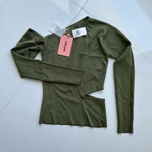 Green top with cut out .